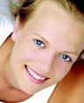 Dental implants are safe, man-made replacements for damaged or missing teeth ... - blonde%20girl%20web