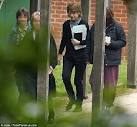Vicky Pryce strolls to the library at her mansion house prison in