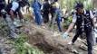 Malaysian authorities find 139 graves of suspected trafficking.