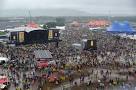 T in the Park 2012: Soaked fans defy rain and mud to party at.