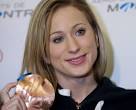 Figure skater Joannie Rochette holds up her bronze medal in Montreal after ... - 366eabae4407bab7acf27b1adcae