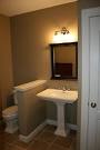 A simple and elegant bathroom in this finished basement also ...