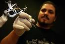 Filipe Gil, a Portuguese tattooist who started his own business in Odivelas ... - pict_20091006PHT61961