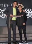 Will Smith cuddles his son Jaden, 14, while promoting their new