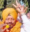 Jujhar Singh flashes a victory sign after being elected as the chairman of ... - chd4