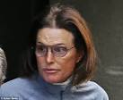 Bruce Jenner leaves a clinic with a bandaged throat after.