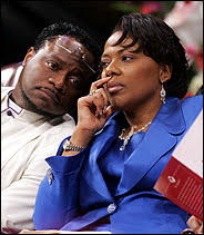 Bishop Eddie Long stands