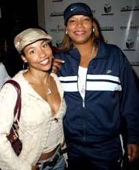 Queen Latifah and her trainer