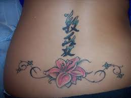 kanji and flower on lower back tattoos