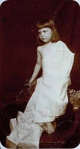 Very young girl nude|Beauty portrait of a very beutiful brown hair european young girl, nude  make up, strong woman. Green eyes. Studio shoot, dark background. Model  posing is not Looking at the camera. , Stock