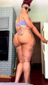 Gloriously large and oily black booty in the spotlight in a hot scene jpg x Large black ass