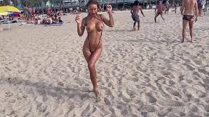 Nudist beach shows off huge tits jpg x Public beach huge tits