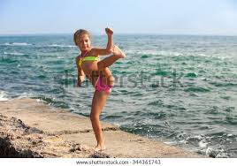 LS  ru little nudist girls|Premium Photo | Little girl in a bathing suit playing on the beach by the  sea