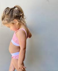 child biquini on instagram studio|Kids in bikini posing in studio | Premium AI-generated image