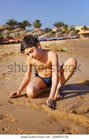preteen boy nude|Small naked boy on a swing in the garden Stock Photo - Alamy
