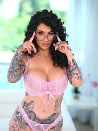 Huge natural tits with tattoos jpg x Tattooed tits