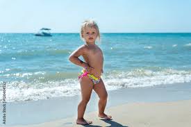 nudist little girl|Adorable little girl on tropical white sandy beach Stock ...