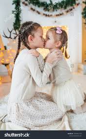 two little girls kissing|two caucasian little girls portrait kissing isolated studio on white  background Stock Photo - Alamy