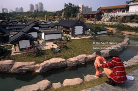 ichildren pee on the street in china|Grandmother looks on as her daughter helps her young son to urinate in the  street,Kunming,Yunnan Province,China Stock Photo - Alamy