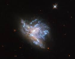 colliding galaxy|Colliding galaxies make love, not war | ESA/Hubble