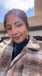Mexican village girl|girl in green clothes running in mexican village park with palm trees in  the background Stock Photo - Alamy
