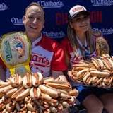 Joey Chestnut fights off protester during hot dog eating contest win