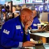 Stocks slip as falling oil prices weigh on energy sector