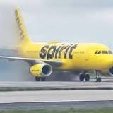 Spirit plane towed after brakes overheat, ignite