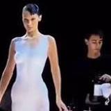 Watch: Model Bella Hadid gets a dress spray-painted on her body on Paris Fashion Week runway