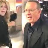 Tom Hanks yells at fans after they almost knock over his wife Rita Wilson