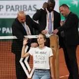 French Open protester ties herself to net during men's semifinal