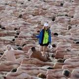 2500 naked volunteers pose for artwork on Australia's Bondi Beach raising awareness for Skin Cancer
