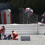 Horror first-corner crash at MotoGP Catalan GP sees rider smash his face into rival's tyre with helmet shattered