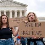 Abortion rights protester locks neck to US Supreme Court fence